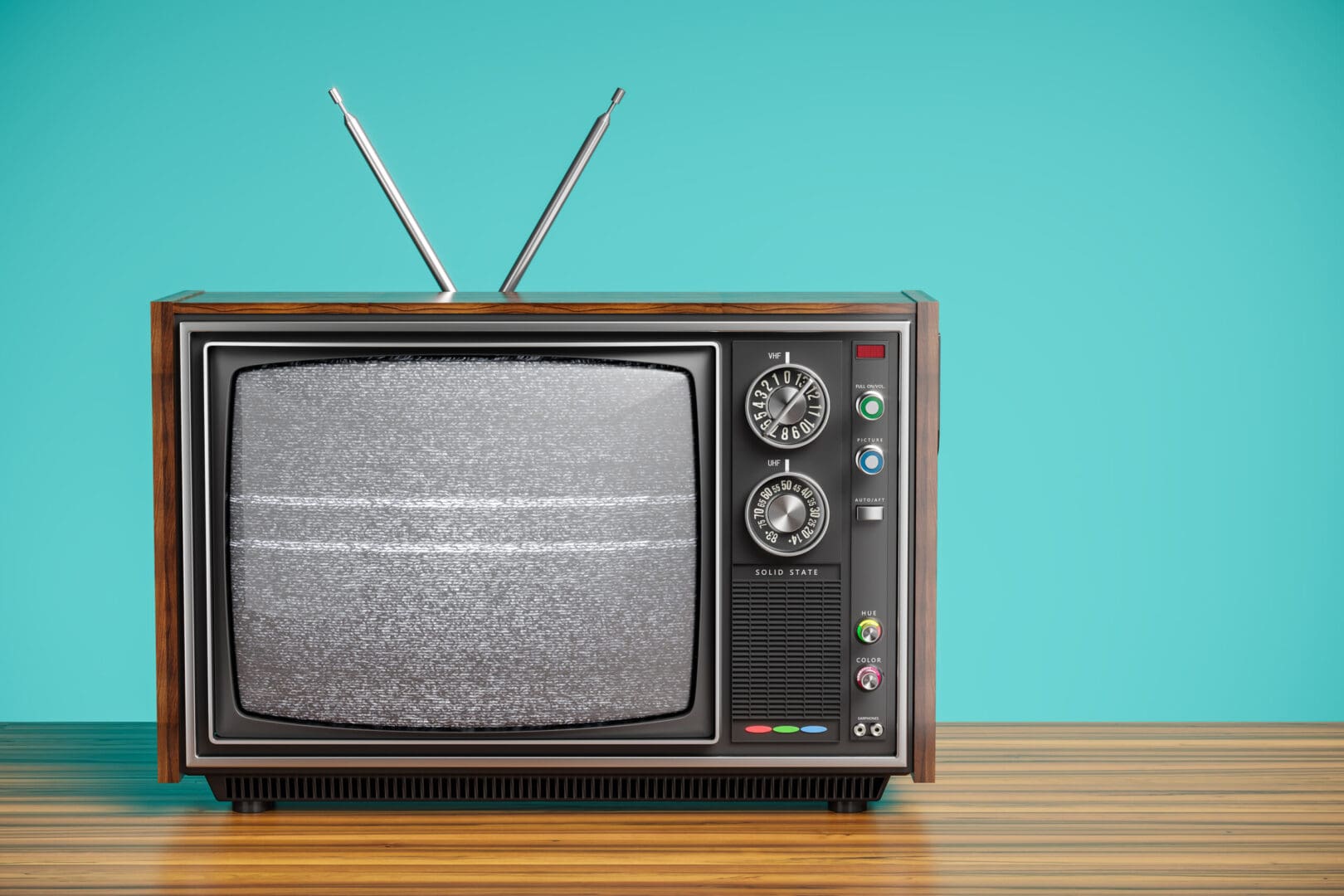 A television set sitting on top of a wooden table.