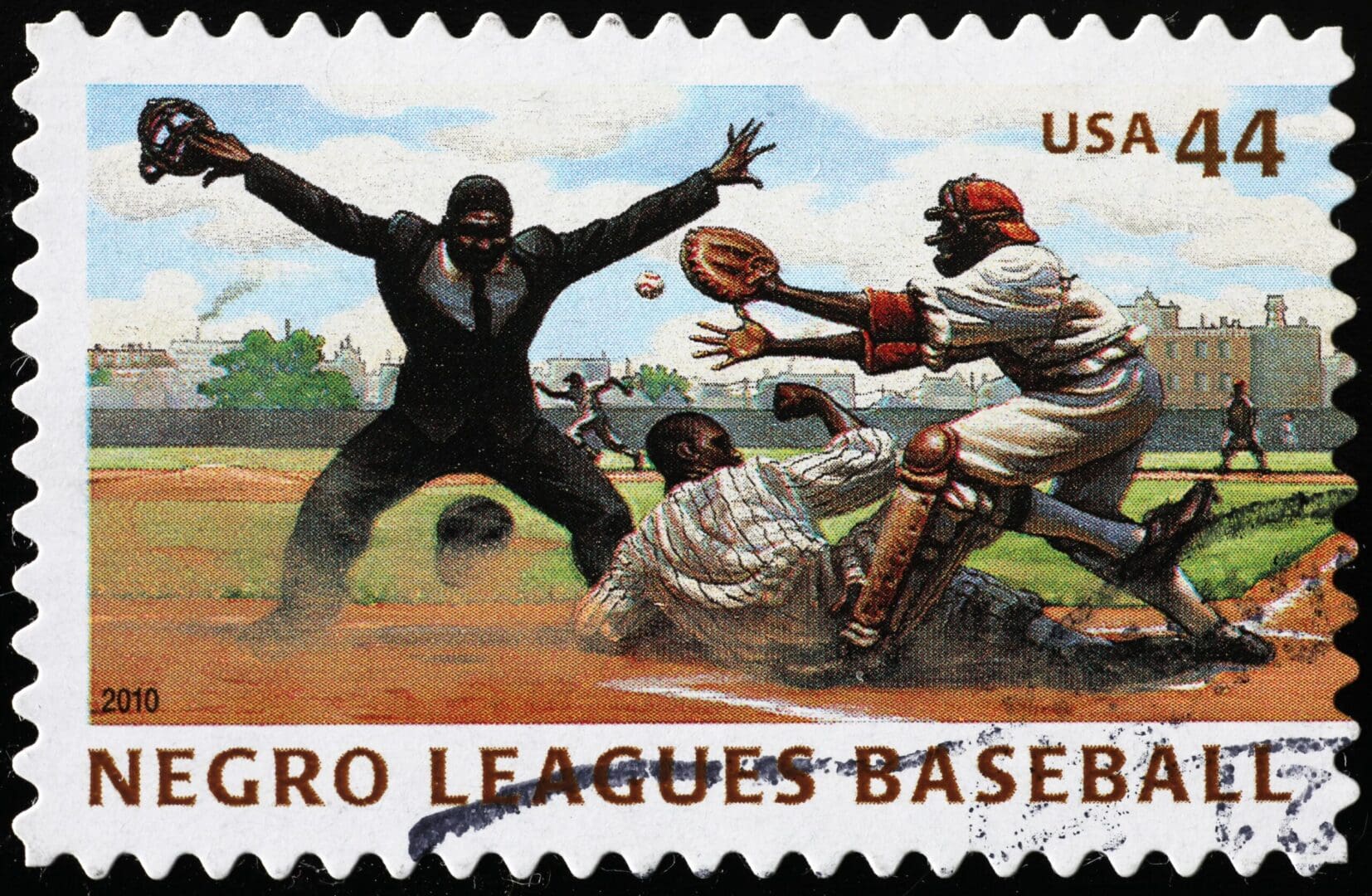 A stamp with a baseball player and catcher.