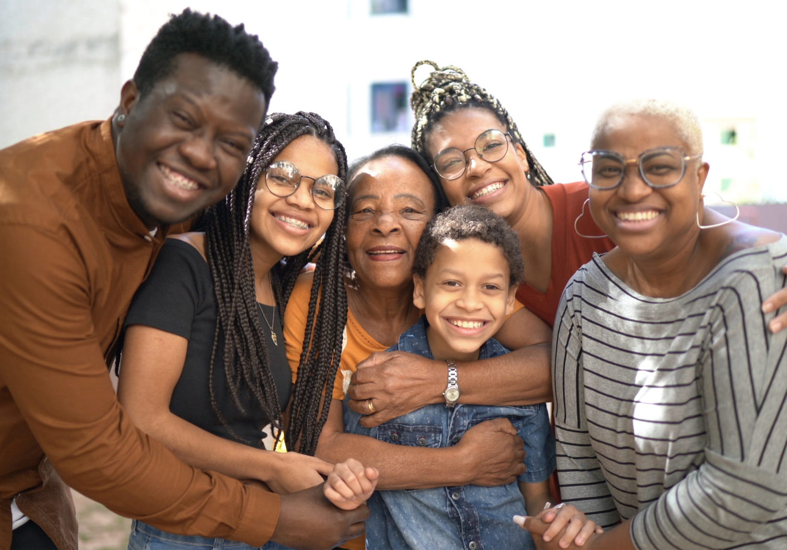 A group of people that are smiling for the camera